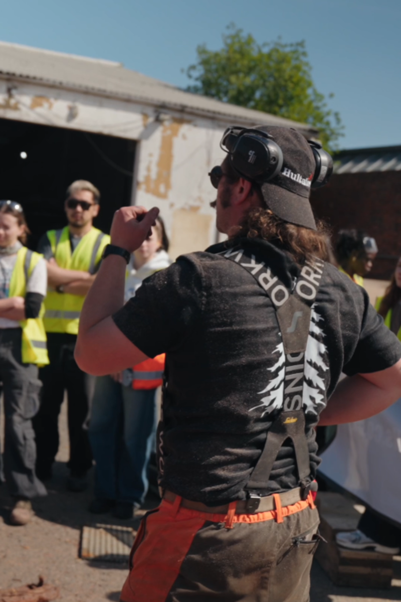 National Sawmills demonstrator addressing visitors at the London milling event