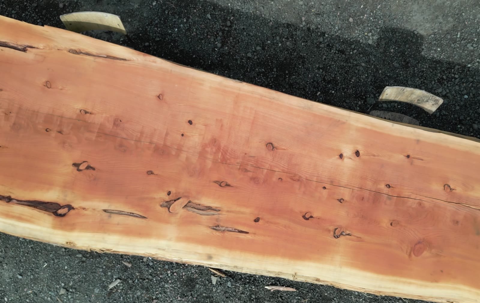 The grain and natural edge of a freshly sawn timber board